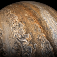 Jupiter cream stirred in dark coffee