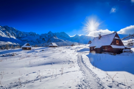 Small mountain cottage in winter valley at sunset - cottage, valley, sky, hills, mountain, sun, winter, sunset, beautiful, snow