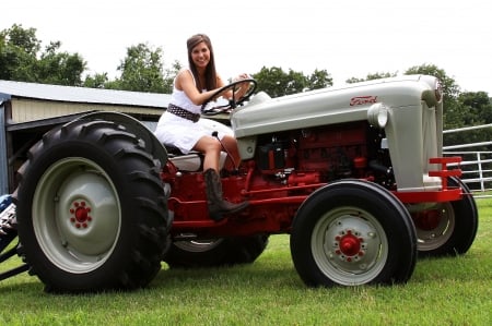 Working The Ranch . . - style, western, women, tractor, models, ranch, outdoors, brunettes, cowgirl, fun, female, boots