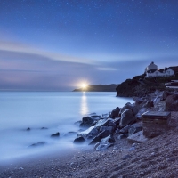 Rocky Shore By The Misty Ocean