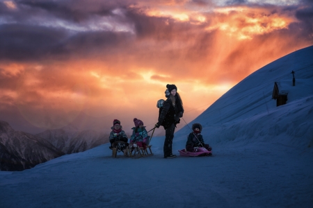 The tobogganing-gang - copil, winter, iarna, evening, mother, girl, blue, john wilhelm, children, sunset, woman