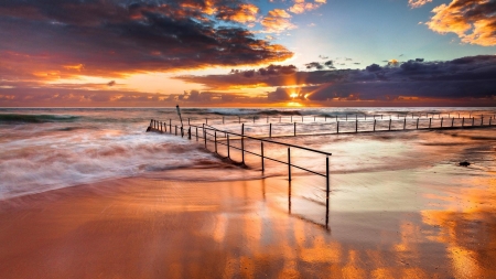 Fenced Beach in Beautiful Sunset - rays, nature, ocean, beach, clouds, sunset, sand, waves