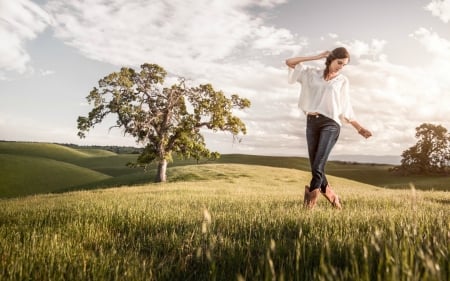 Carefree Day - clouds, trees, hills, boots, fields, grass, tree, cowgirl, field, brunette, sky