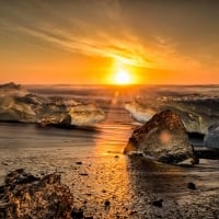 Ice on Beach During Sunset