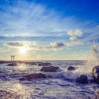 Sea Waves Crushing in Stones During Sunset