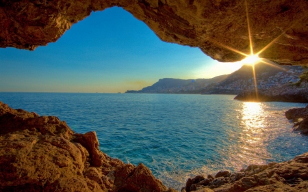 Sunset Through The Cave - cave, sunset, nature, landscape, sea, rocks, sky