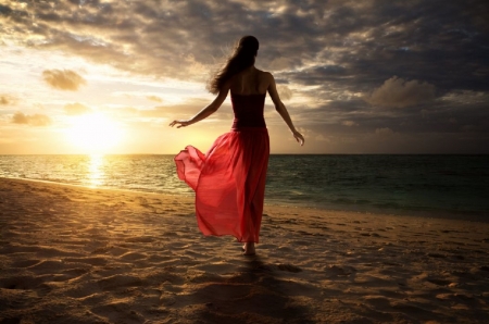 A pleasant evening by the sea - ocean, sheer, red dress, brunette, sunset, sand, walking along the beach