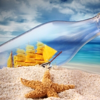 Ship In A Bottle On Sand