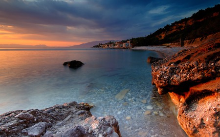 Sunset - village, clouds, coast, sea, rocks, sun