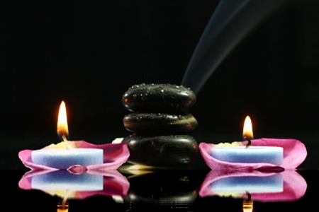 Lighted candles - spa, meditation, pebbles, candles