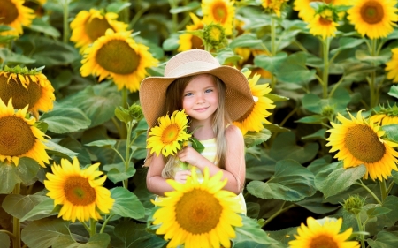 Little Girl between Sunflowers - sunflowers, yellow, girl, hat, flowers