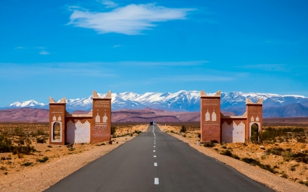 Gate on the Road - gate, desert, road, mountains, sky