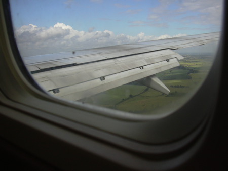 View from a plane - horizon, photography, countryside, plane, aeroplane, flying, view, window, wing, clouds, fly