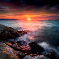 Shine from Rocky Sea Sunset