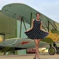 Maria Ryabushkina Posing with a Russian Bi-Plane