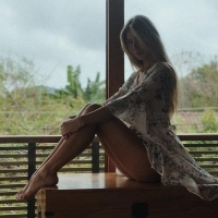 Anjelica Ebbi by the Window