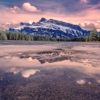 Colorful Cloud Reflections in Mountain Lake