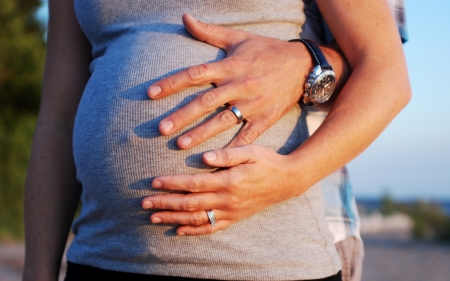 Family - hands, unborn baby, father, mother, family