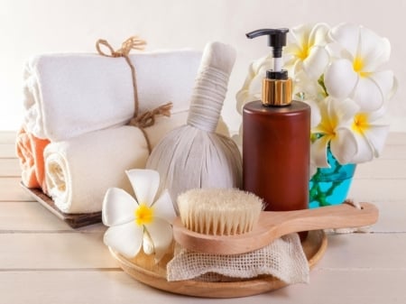 Spa concept - Towel, Oil, Flowers, Brush