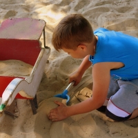 Boy Playing with Sand