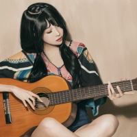 Asian girl playing the guitar