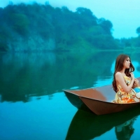 asian girl on the blue lake