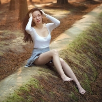 Girl sitting in the wood