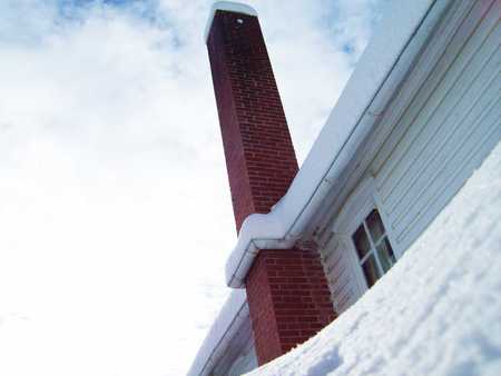 Tall Red Chimney - chimney, trees, blue, snow, flowers, black, countryside, white, green, cloud, leaf, rust, sky, building