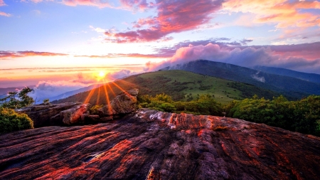 Sunset beams streaming over mountains - sunbeams, cloud, mountain, clouds, light, sun, mountains, sunset