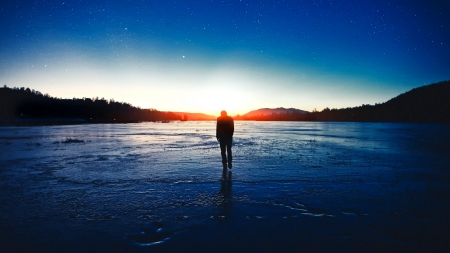 Man walks solemnly into colorful sunrise - sky, beach, sun, water, mountains, colour, man, color, sunrise