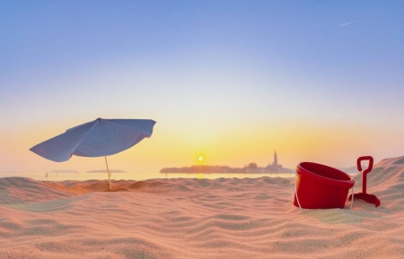 Beach at Sunset - umbrella, sunset, town, shovel, bucket, sand, sky