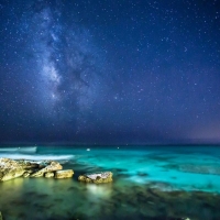 Night Sky over Ocean Horizon