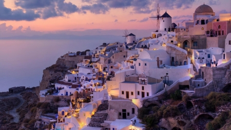 Greek houses on a hill by the water during a pink sunset - house, water, greek, beach, evening, ocean, pink, dark, shore, white, sunset, twilight, greece, houses, sky