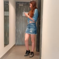 Deniz with short denim skirt in hotel room