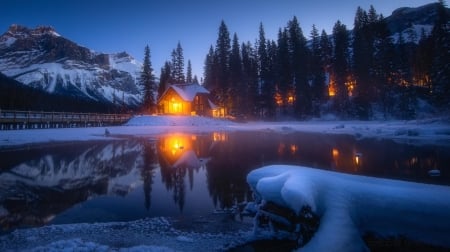 A House with a Burning Light - house, trees, winter, nature, lights, snow, mountains