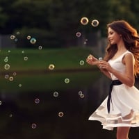 Pretty Model Blowing Bubbles