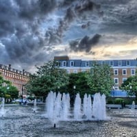 FOUNTAIN UNDER DARK CLOUDS