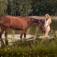 Cowgirl Cooling Off with her Horse