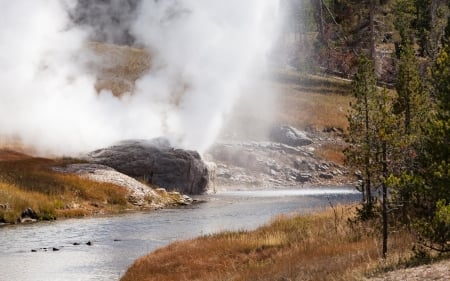 Riverside geyser throwing some shade - water, mountains, iceland, rocks