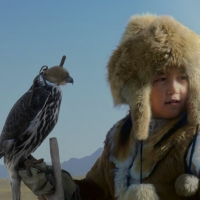 Young Mongolian Girl with her Hunting Bird