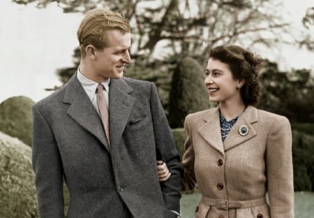 Happy Times celebrating their Honeymoon - trees, beige coat with belt, earrings, grey long wool coat, brooch, tie and shirt, red head