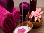 Pink spa with  candle and towels