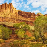 Dappled light passes across The Castle at Capitol Reef National Park, Utah