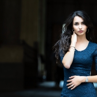 cool female model with a dark blue dress