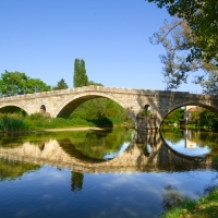 Old stone bridge and reflection