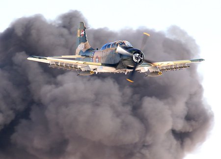 skyraider with smoke cloud - rockets, airshow, bombs