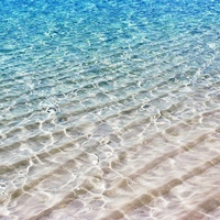 Translucent Sea Water Shimmer over White Sand