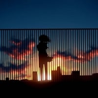 sunset through  a fence