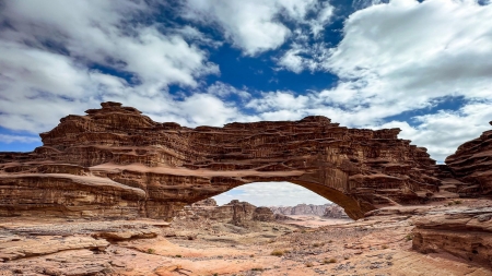 Hisma Desert, Saudi Arabia - landscape, sky, rocks, arch, clouds