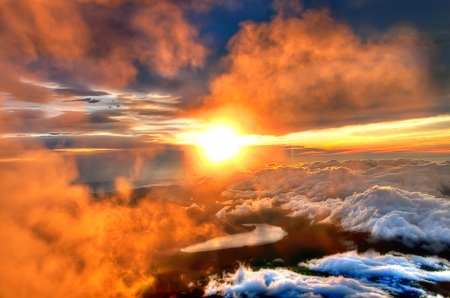 A golden sunrise marred by clouds over a Chinese mountain range - clouds, blue, golden hour, snow, chinese, sunrise, china, gold, mountains, sun